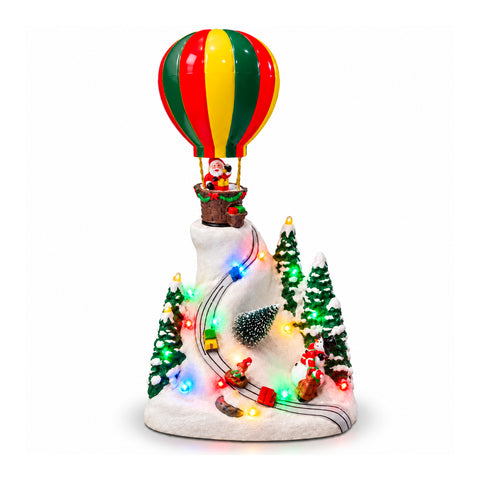 Paysage de Noël avec le père Noël volant, lumières LED et musique