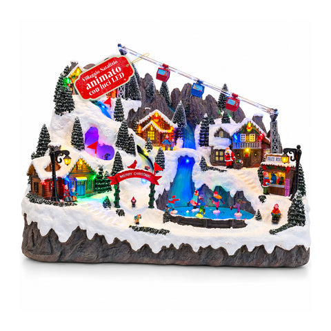 Village de Noël lumineux avec pistes de ski et de patinage en mouvement, lumières LED et musique – 56x37x42 cm